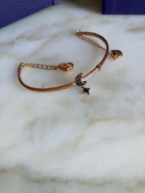 SWAROVSKI Rose Gold Crescent Moon & Star Bracelet with Black and Clear Stones